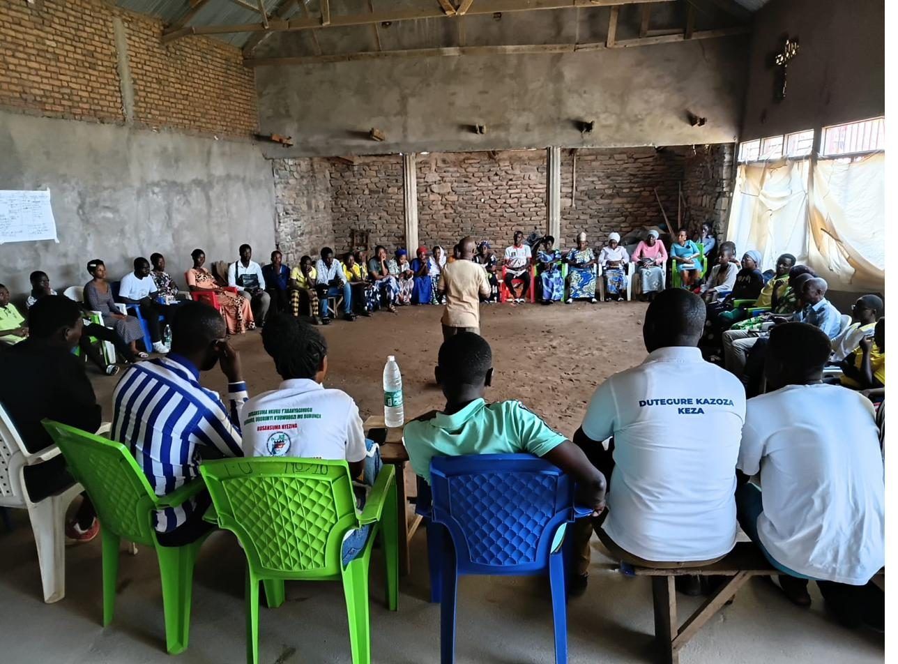 People gathered in a community learning circle in Burundi